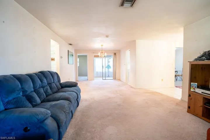 Large living room leading to formal dining area.