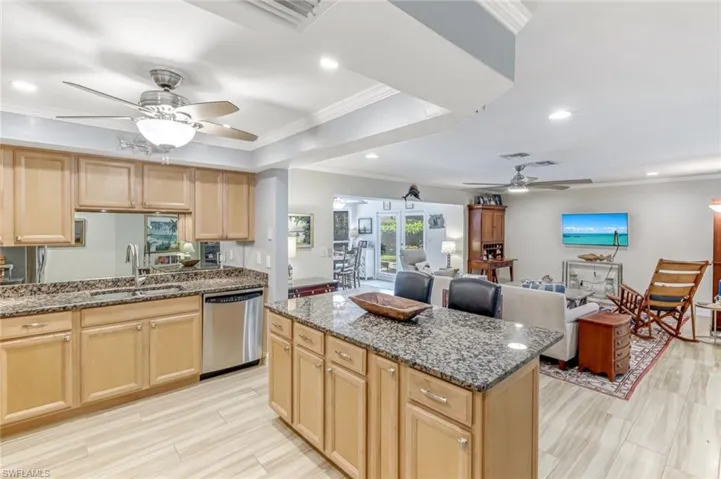 Views of the Kitchen to the Living Room and Dining Room