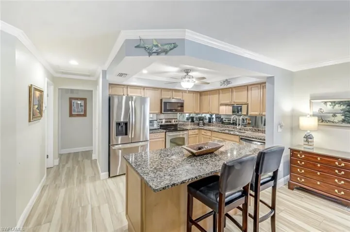 Kitchen has modern stainless steel appliances
