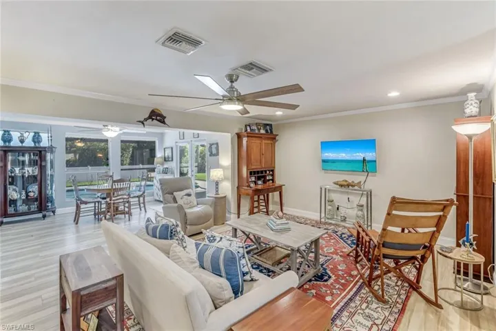 Enjoy the pool views from the dining room, living room and den/office