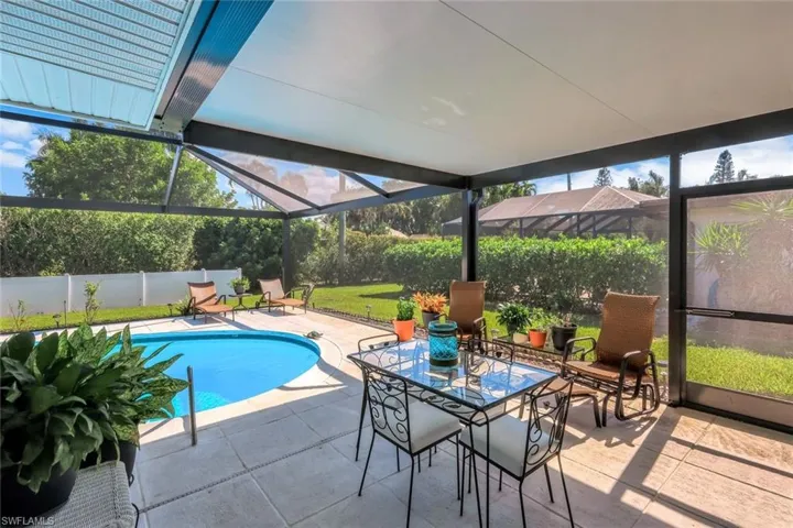 Covered area of this lanai is perfect for outdoor seating and dining - perfect spot to get retreat from the sunshine!