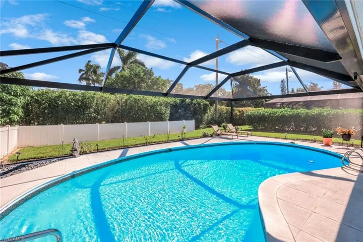 Privacy hedges surround this yard space allowing for quiet outdoor living