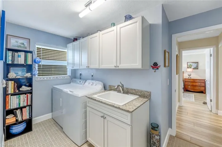 Laundry Room has built-in cabinetry and sink