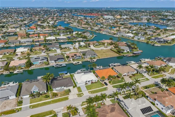 View of property location featuring nearby suburban area and a large body of water