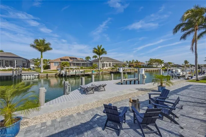 Dock featuring a residential view, a water view, and boat lift