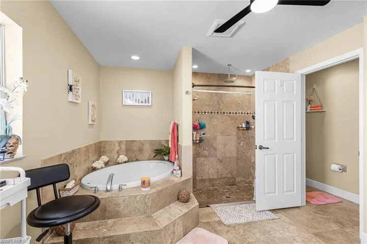 Full bathroom with a bath, a tile shower, ceiling fan, and recessed lighting