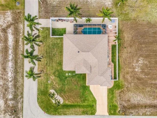 Aerial view of property and surrounding area with a pool