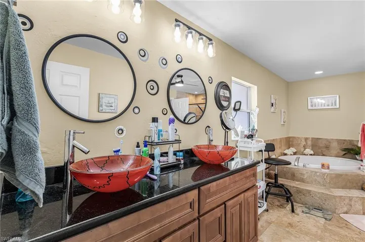 Full bath with a bath and double vanity