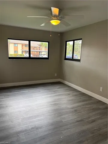 Second master bedroom with ceiling fan, and wood finished floor