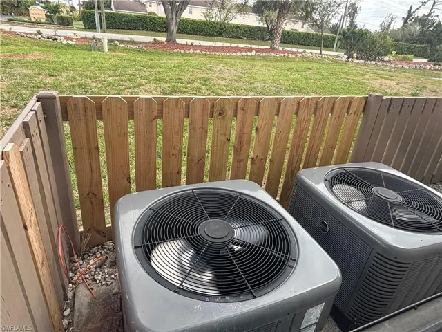 Details featuring central AC and fence