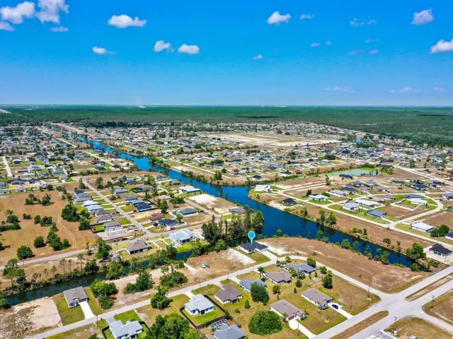 Aerial view with a water view and a residential view