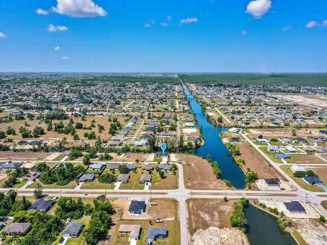 Aerial view with a residential view and a water view