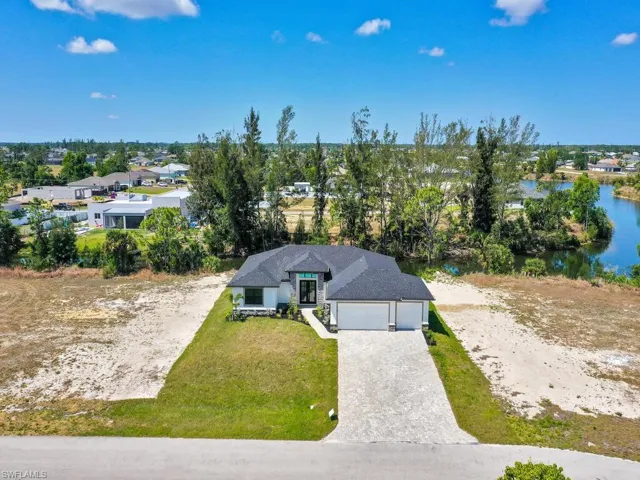 Aerial view with a water view and a residential view