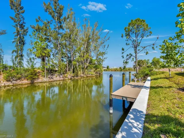 Dock area featuring a water view
