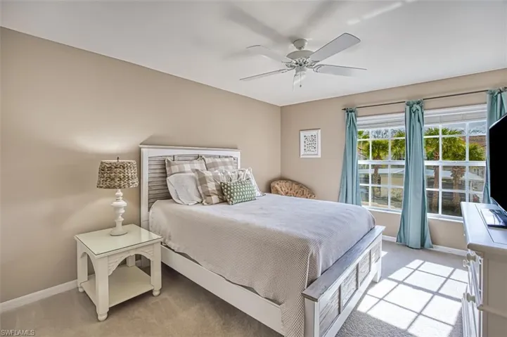 Bedroom featuring carpet floors and ceiling fan