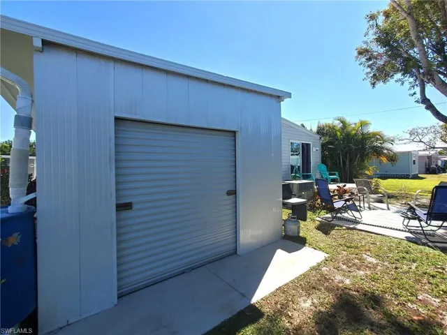 Garage for your golf cart or mini roadster! Rear showing the overhead door. You can store all your toys here!