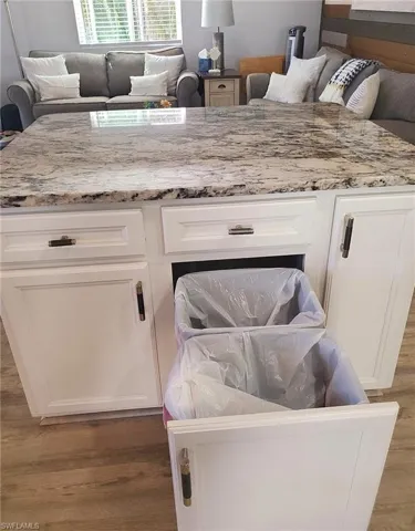 Slide-outs for trash & recycling.
