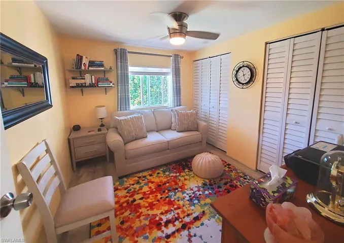 Guest bedroom with sleeper sofa and 2 closets.