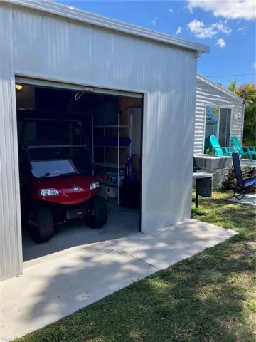 GOLF CART GARAGE! Ample storage space for a small roadster or seasonal items.