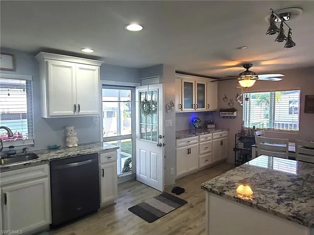 No-fingerprint Whirlpool Stainless steel appliances including dishwasher & microwave, refrigerator with ice, soft-close cabinets & drawers.