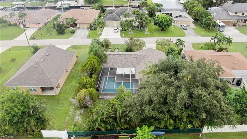 Aerial view of residential area featuring a pool area