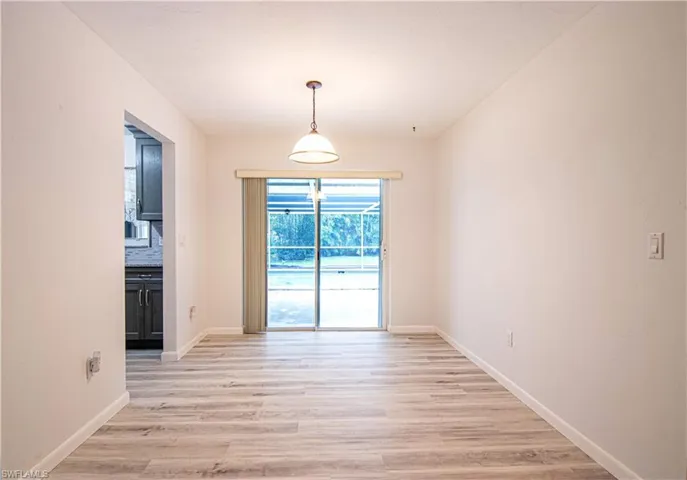 Unfurnished dining area featuring light wood finished floors