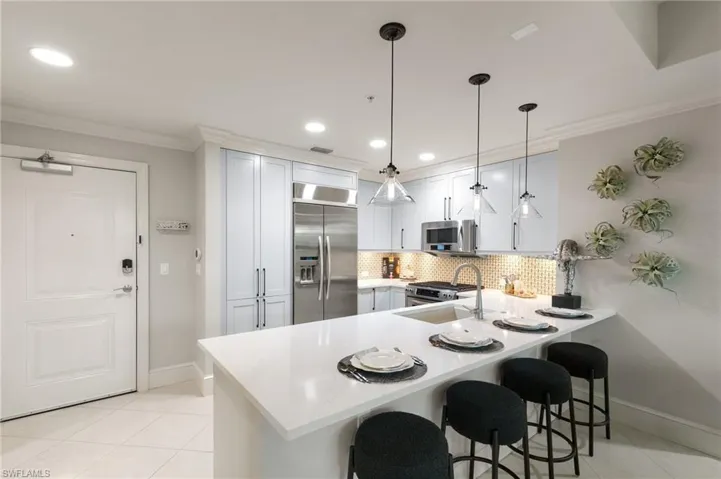 9115  Strada  PL, Naples, FL 34108