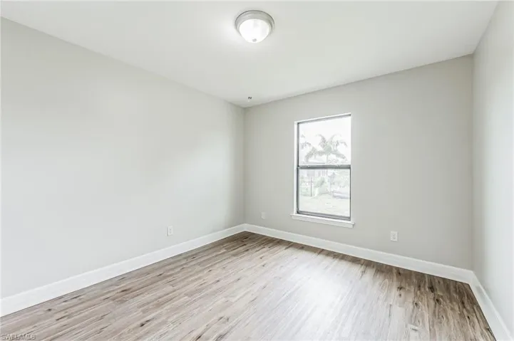 Unfurnished room with light hardwood / wood-style flooring