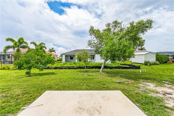 View of yard featuring a patio and a lanai