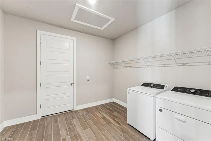 Laundry room featuring washer and clothes dryer
