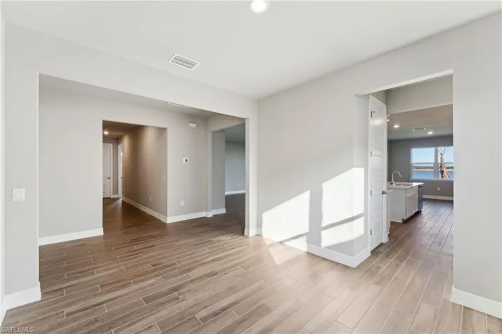 Spare room featuring sink and light hardwood / wood-style floors