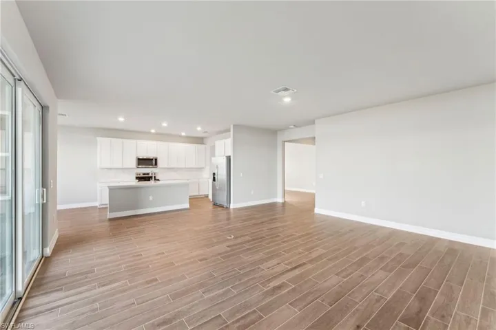 Unfurnished living room with light wood-type flooring