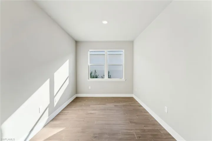 Spare room featuring light wood-type flooring