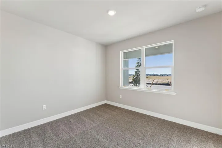 Spare room with carpet flooring