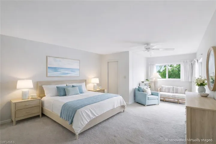 AI renovated/virtually staged. Bedroom featuring carpet flooring, a ceiling fan, and a closet