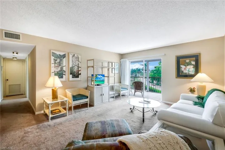 Family room with sliding glass doors to the lanai