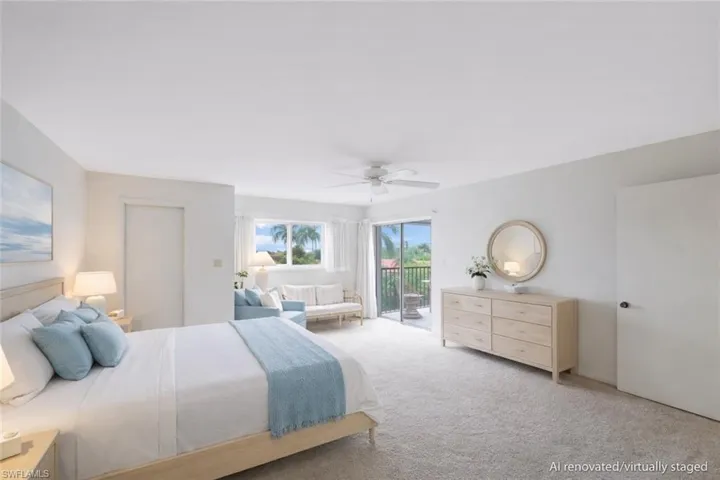 AI renovated/virtually staged. Bedroom with access to outside, carpet flooring, and ceiling fan