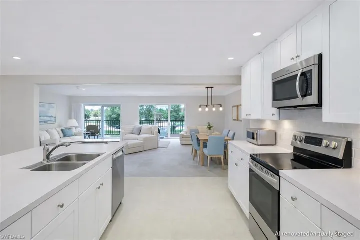 AI renovated/virtually staged. Kitchen with stainless steel appliances, light countertops, white cabinets, open floor plan, and backsplash
