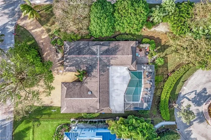 Aerial View of the existing house with circular driveway, swimming pool and mature landscaping