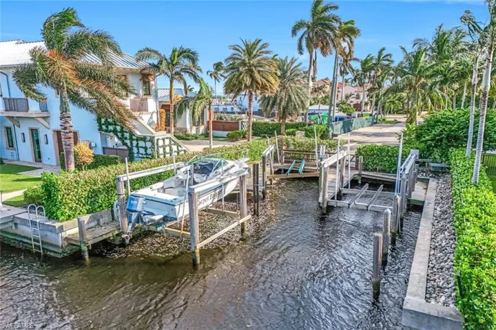 Deeded boat dock and lift (shown with boat on it) is included in price. Electric and water is available at the dock