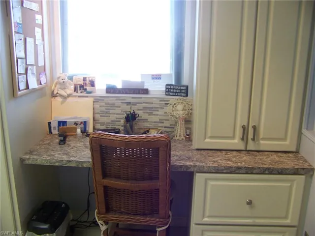 Kitchen built-in desk, drawers and nice glass backsplash!