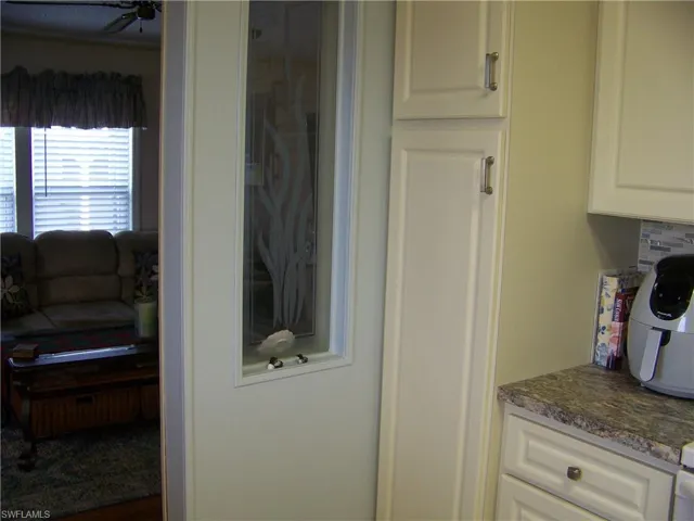 Broom closet, etc. Deco windows overlooking living area.