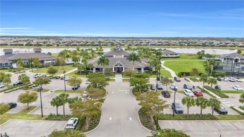 Aerial perspective of suburban area with a large body of water