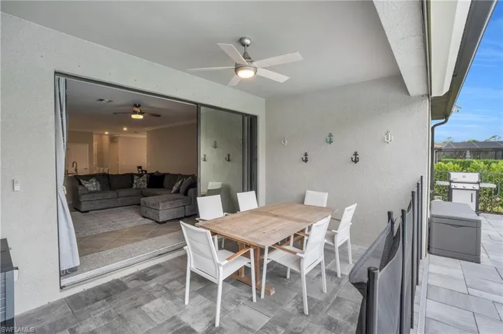 Dining room with a textured wall and ceiling fan