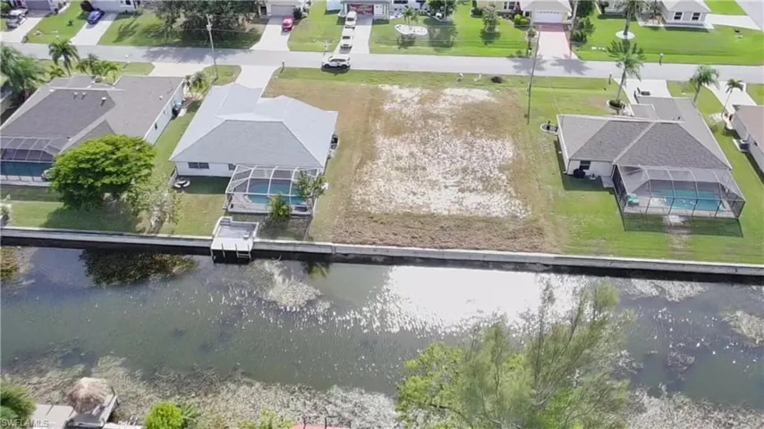 Aerial view of residential area with a large body of water