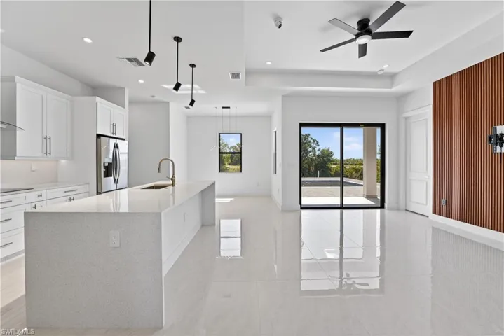 Open-concept living area with large-format tile flooring
