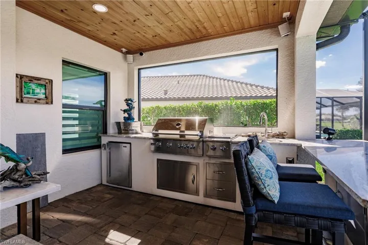Custom outdoor kitchen with bar