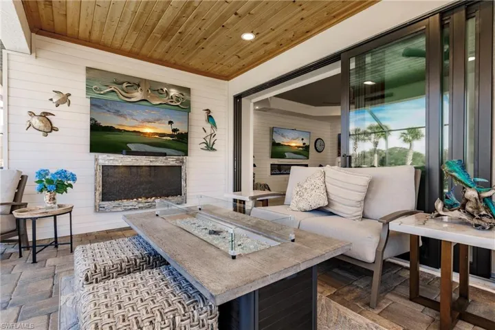 Custom ceiling and gas fireplace in large lanai area