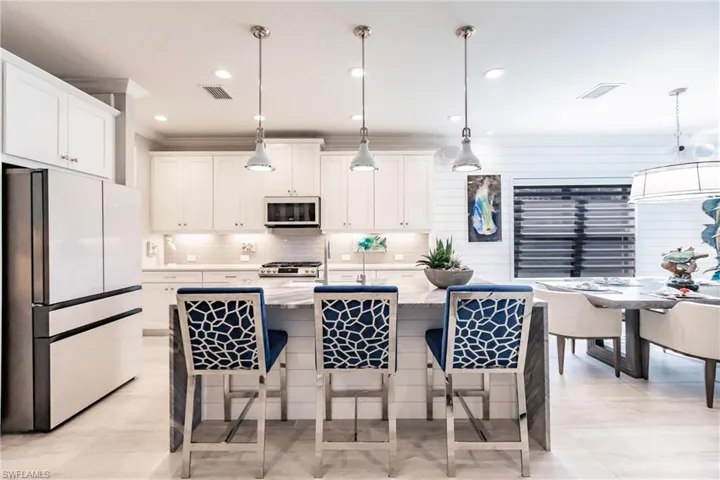 Open concept kitchen to great room. All Samsung appliances have been upgraded to glass fronts