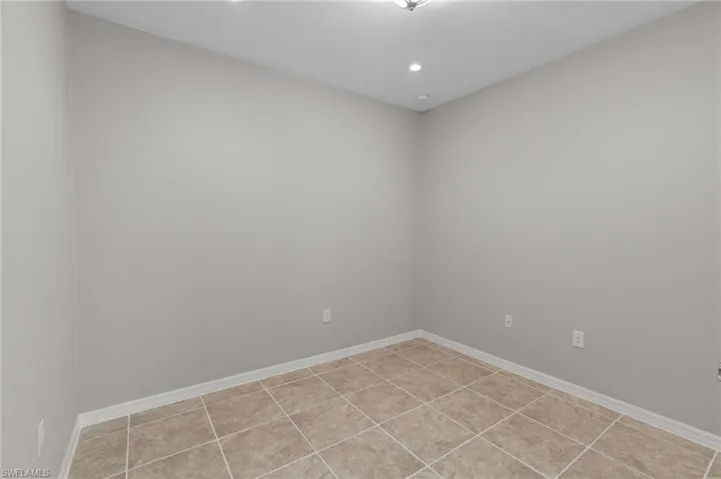 Unfurnished Den with baseboards and recessed lighting